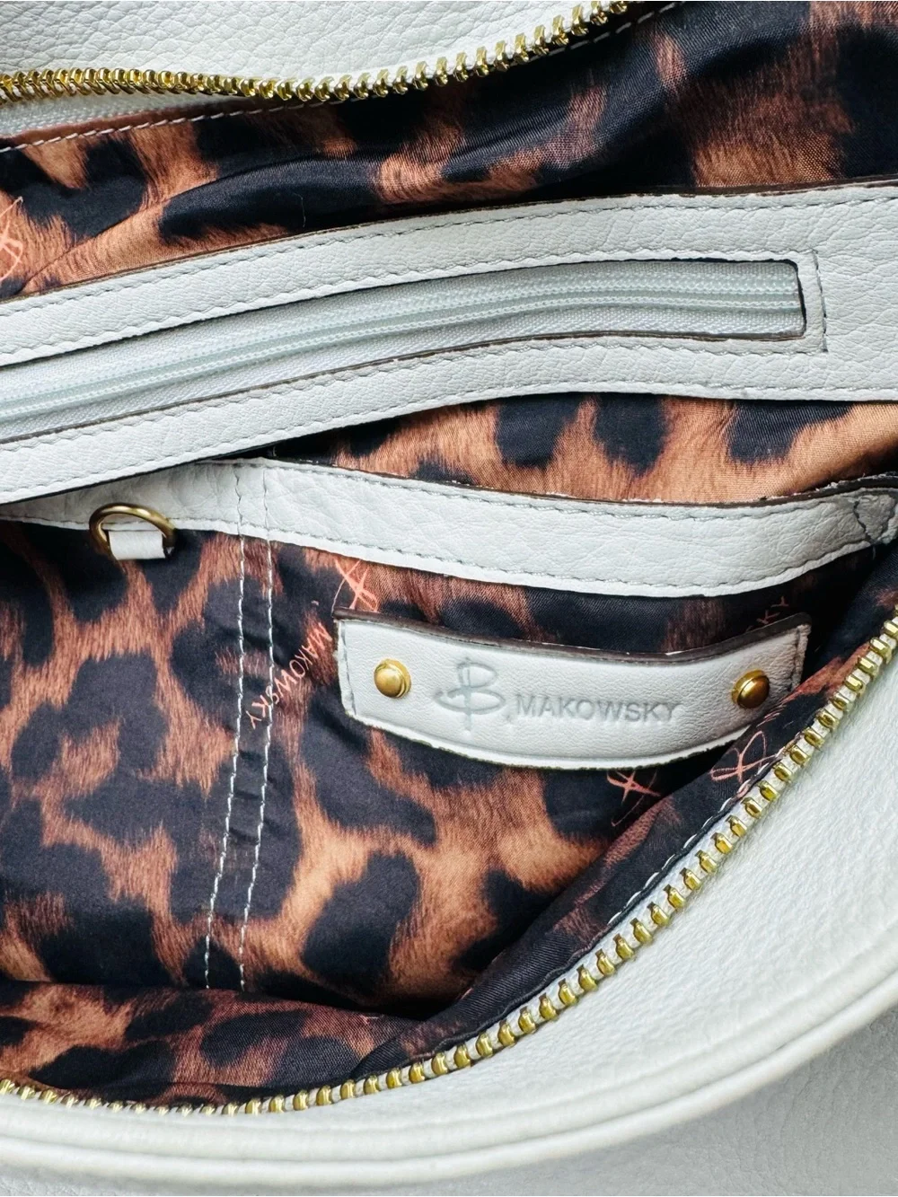 B. Makowsky Leather Ivory Hobo handbag. Gold-tone stud accent hardware.